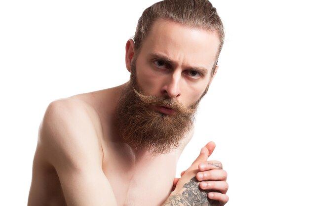 Cool bearded guy on white background in studio photo