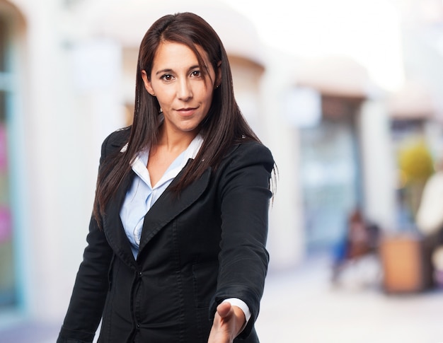 Free photo cool business woman greeting sign