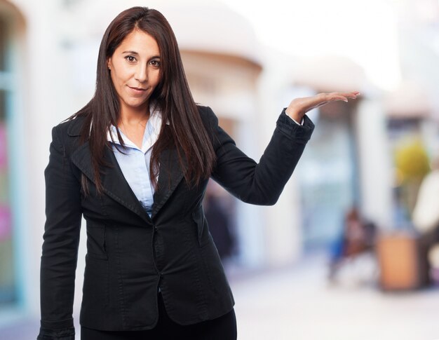 cool business-woman holding something