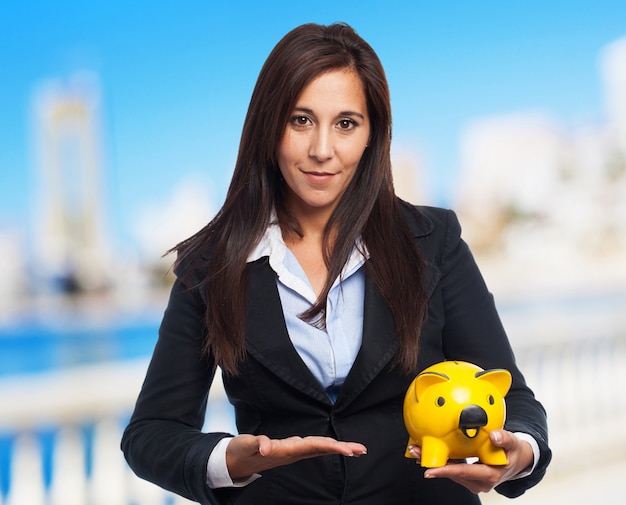cool business-woman with piggy-bank