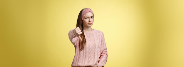 Free photo not cool frustrated displeased and disagree cute young woman wearing knitted sweater frowning