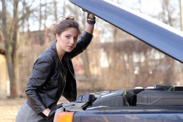 Cool girl by the car