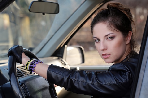 Free photo cool girl in the car