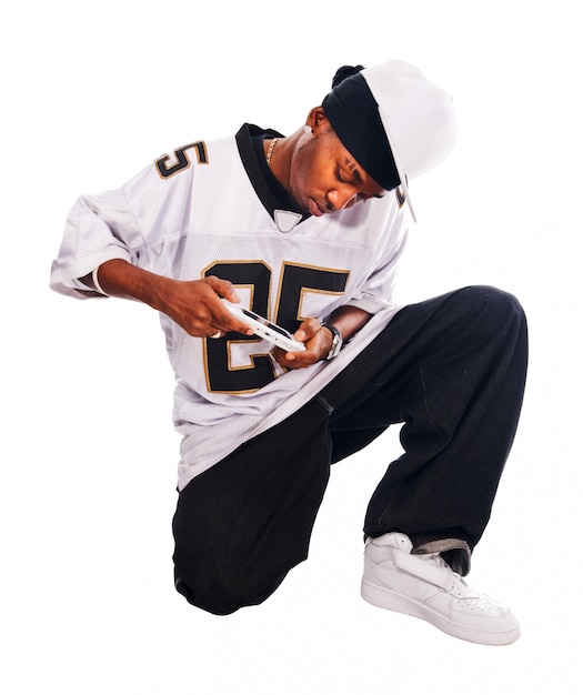 Cool hip-hop young man on white playing