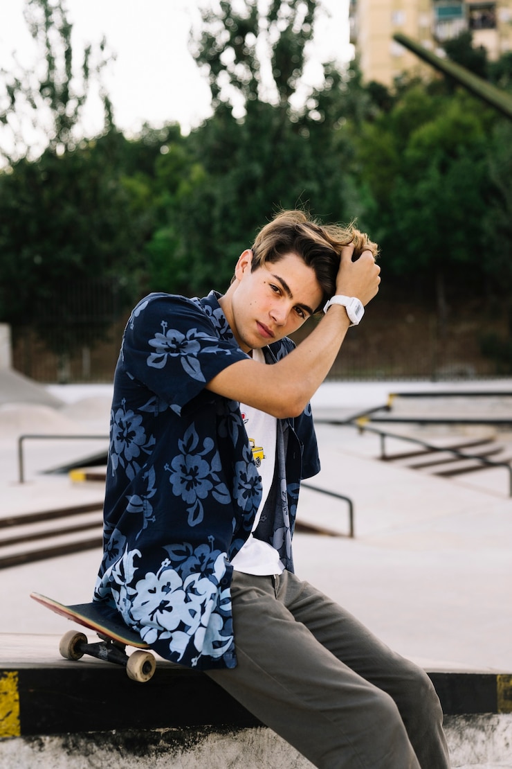 Free Photo cool skater boy touching his hair