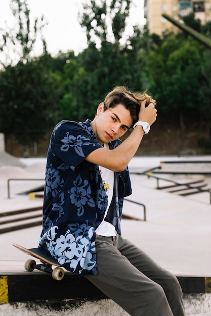 Cool skater boy touching his hair