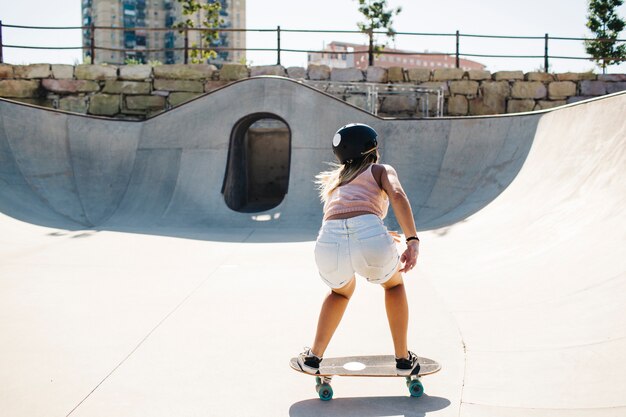 Cool woman skating on a sunny day