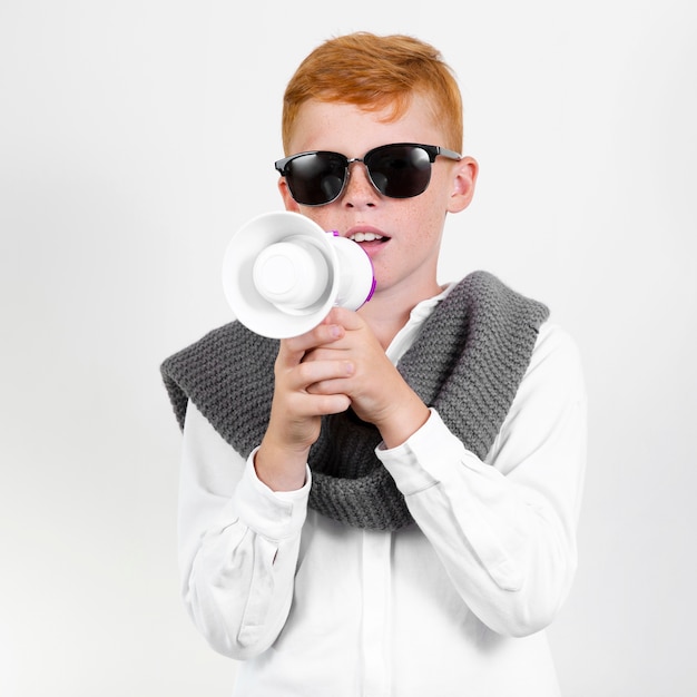 Cool young boy with sunglasses