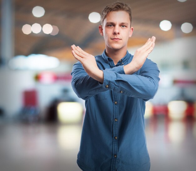 cool young-man cross-gesture