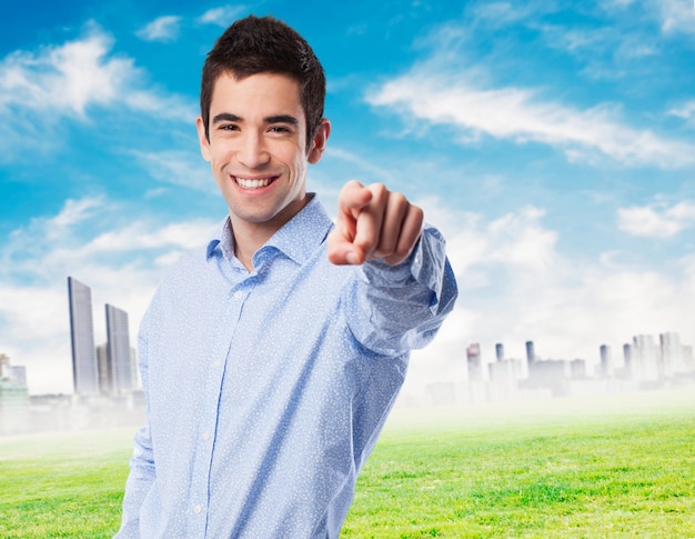 cool young-man pointing to front