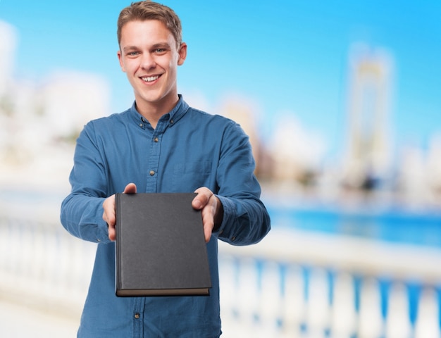 Free photo cool young-man with book