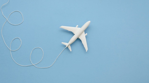 Copy-space airplane toy on table