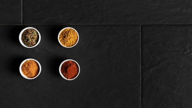 Copy-space bowls with condiments on table