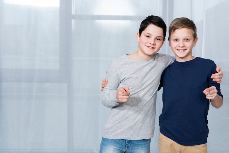 Free Photo copy-space boys pointing