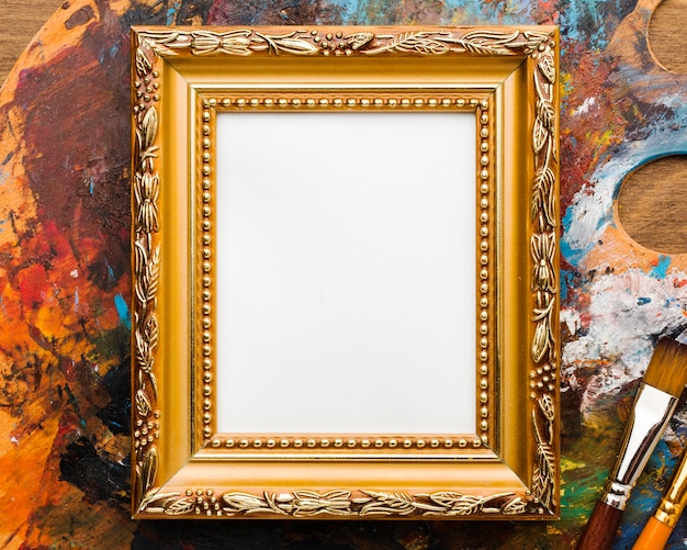 Copy space canvas in golden frame and paint