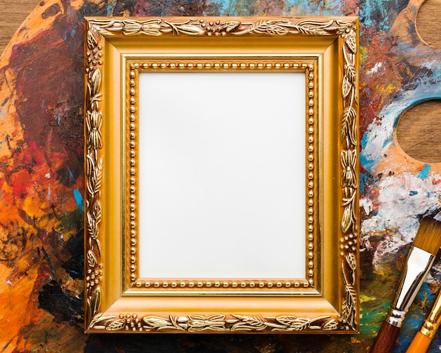 Copy space canvas in golden frame and paint