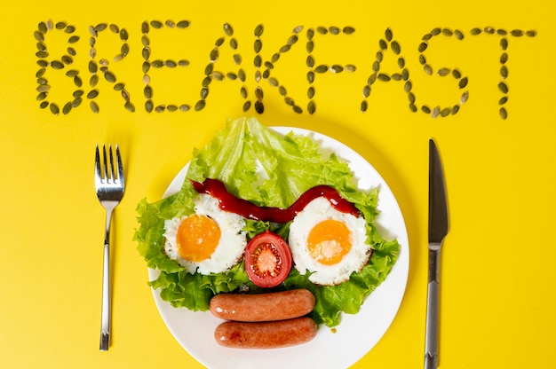 Copy space fried egg with fresh vegetables face arrangement on plain background