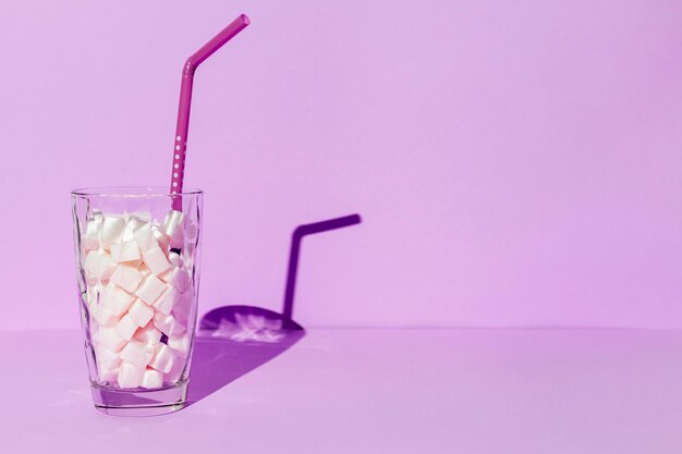 copy-space glass with sugar cubes