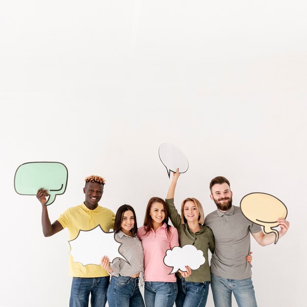 Copy-space group of friends holding chat bubble