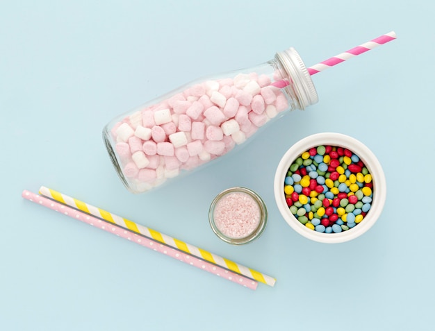 Copy-space jar with sweets on table