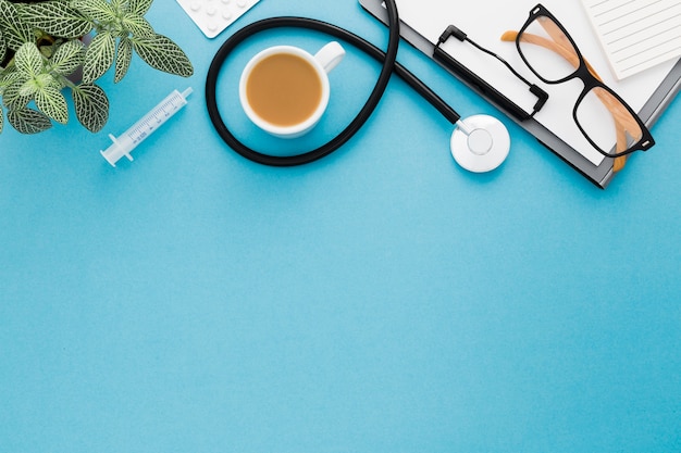 Copy-space medical desk with coffee cup