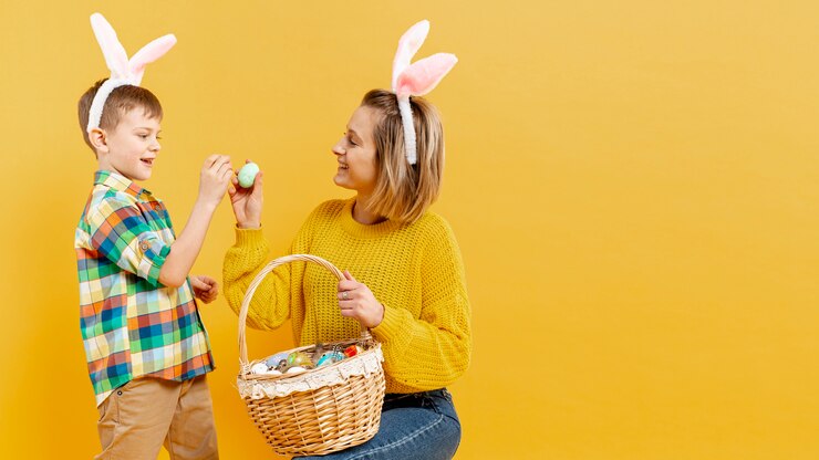 Free Photo copy-space mother and son with painted eggs