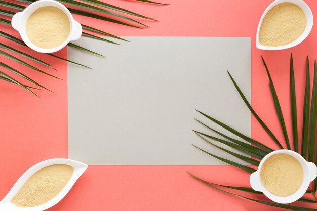 Copy space paper and bowls with sand in them