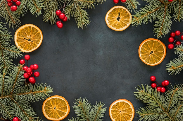 Free photo copy space pine needles and mistletoe and lemon