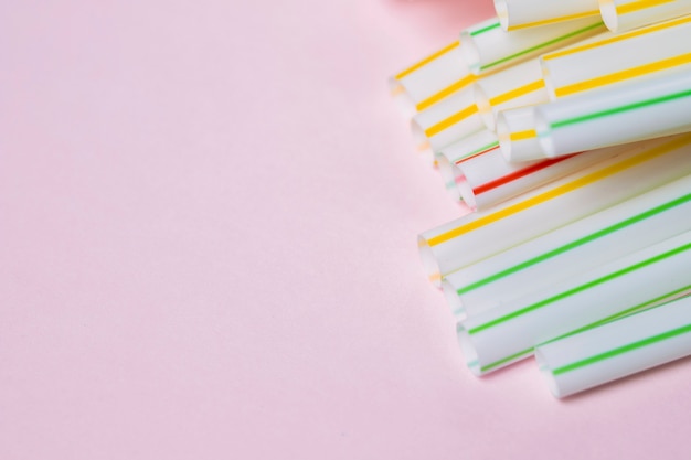 Copy-space plastic straw collection on table