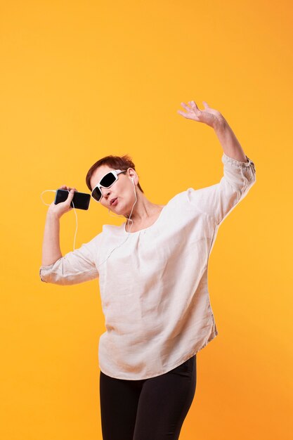 copy-space senior woman dancing