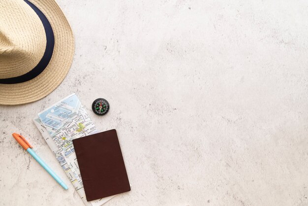 Copy space straw hat and map