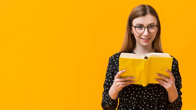 Free photo copy-space woman reading book