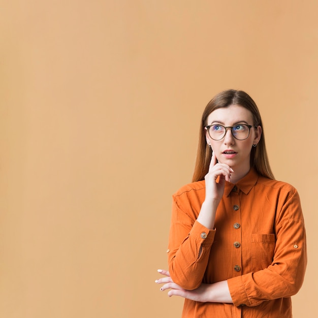 Copy-space young woman with arms crossed