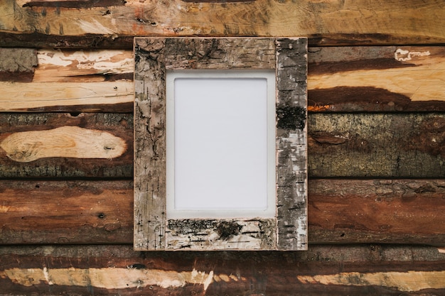 Free photo cork frame on wooden background