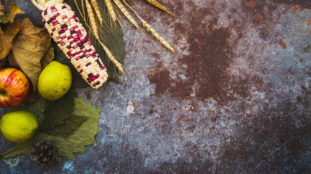 Corn and fruit on asphalt