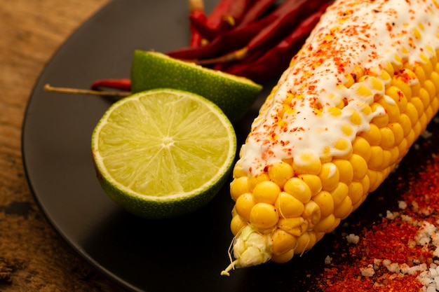 Corn on plate with limes close-up