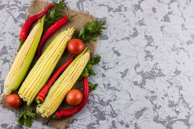 Corn and tomatoes with copy space