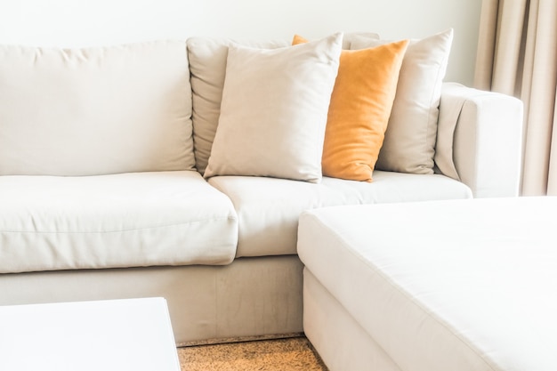 Corner of the couch with cushions