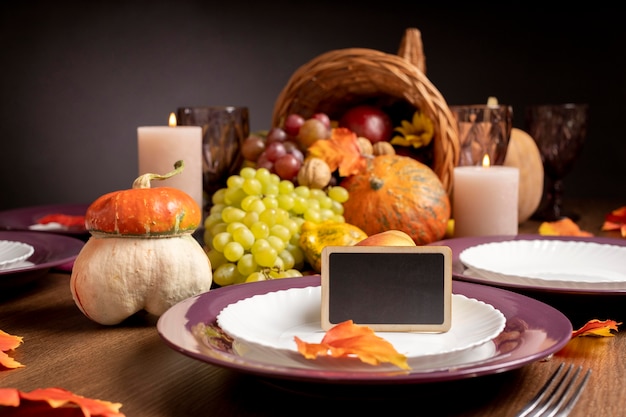 Cornucopia arrangement with delicious foods and empty blackboard