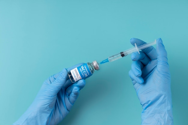 Coronavirus arrangement with vaccine bottle and syringe