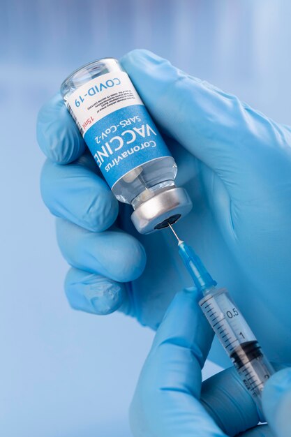 Coronavirus arrangement with vaccine bottle and syringe