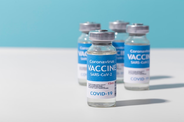 Free photo coronavirus arrangement with vaccine recipients