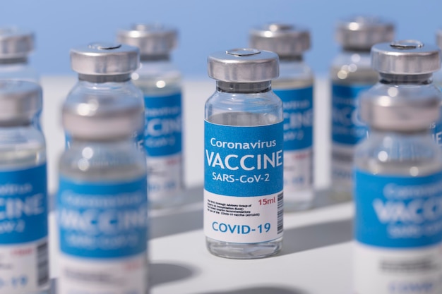 Free photo coronavirus arrangement with vaccine recipients