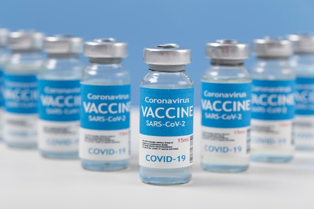 Free photo coronavirus arrangement with vaccine recipients