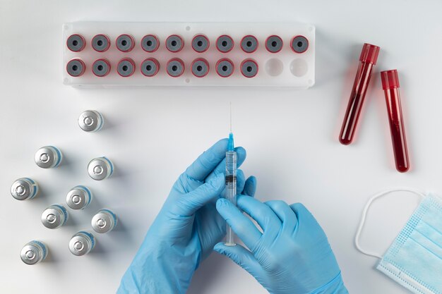 Free Photo coronavirus assortment with blood samples and vaccine