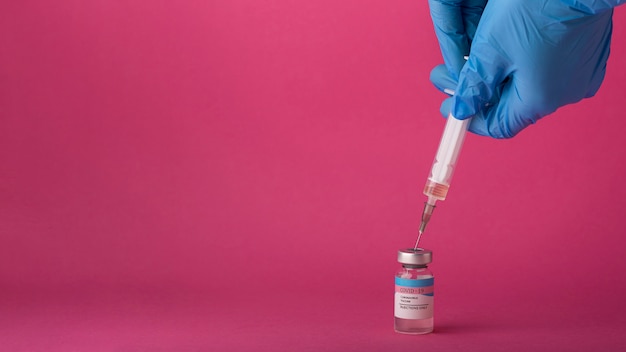 Coronavirus vaccine assortment on pink