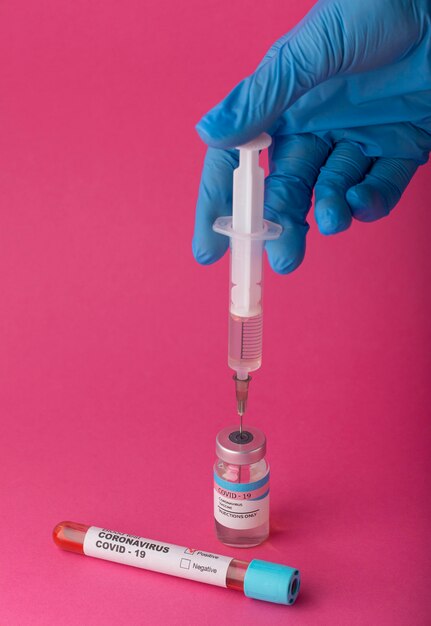 Coronavirus vaccine assortment on pink