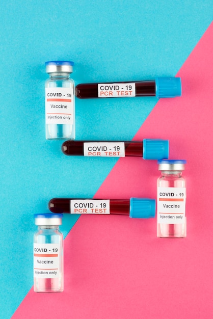 Coronavirus vaccine vials and tests arrangement