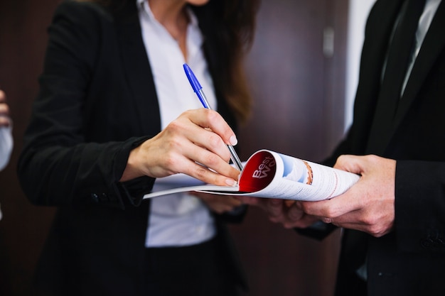 Corporate business people holding brochure