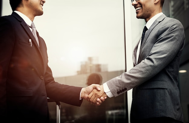 Corporate businessmen shaking hands